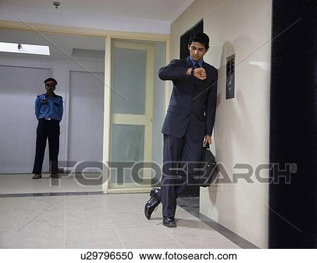 Stock Image - Waiting for the elevator. Fotosearch