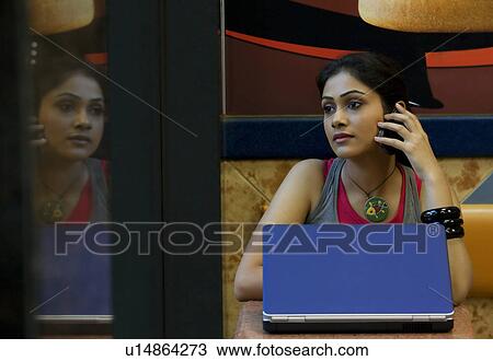 Woman at a restaurant View Large Photo Image Stock Image - Woman at a restaurant. Fotosearch