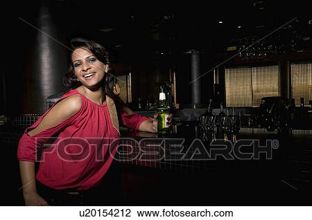 Woman at the bar counter View Large Photo Image Stock Image - Woman at the bar counter. Fotosearch