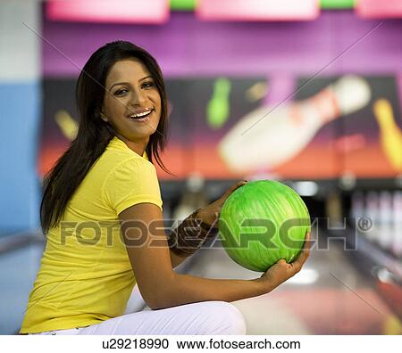 Woman at the bowling alley View Large Photo Image Stock Image - Woman at the bowling alley. Fotosearch