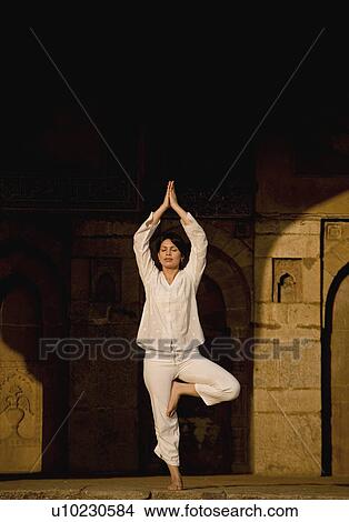 Picture - Woman doing yoga. Fotosearch