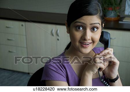Stock Image - Woman executive on the phone. Fotosearch