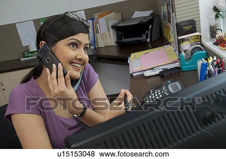Stock Photo - Woman executive on the phone. Fotosearch
