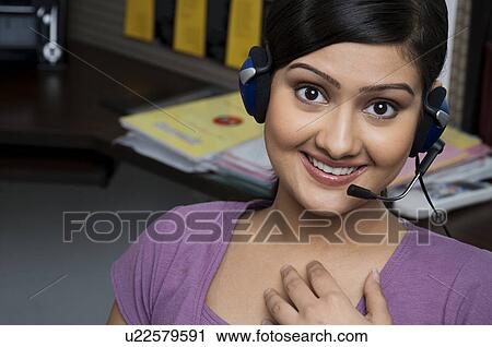 Woman executive taking a call View Large Photo Image Stock Image - Woman executive taking a call. Fotosearch