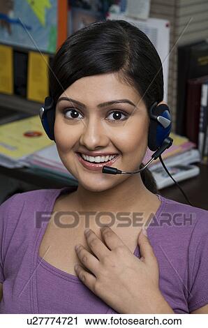 Stock Image - Woman executive taking a call. Fotosearch