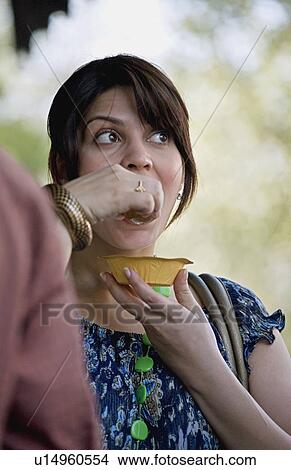 Woman having Gol Gappa View Large Photo Image Picture - Woman having Gol Gappa. Fotosearch