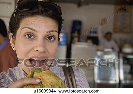 Woman having street food View Large Photo Image Picture - Woman having street food. Fotosearch