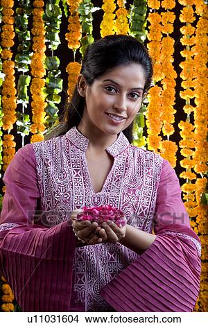 Woman offering flowers View Large Photo Image Picture - Woman offering flowers. Fotosearch