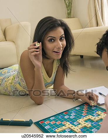 Woman playing scrabble View Large Photo Image Stock Image - Woman playing scrabble. Fotosearch
