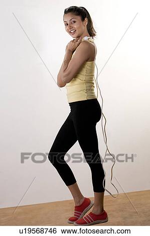 Stock Photograph - Woman posing with skipping rope. Fotosearch