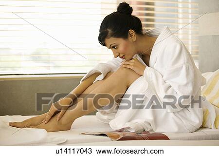 Stock Image - Woman relaxing at a spa. Fotosearch
