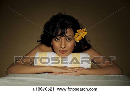 Stock Image - Woman relaxing at a spa. Fotosearch
