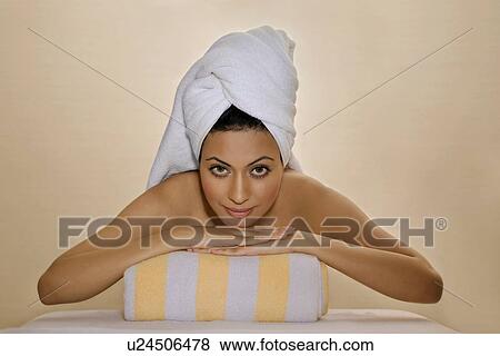 Stock Photo - Woman relaxing at a spa. Fotosearch