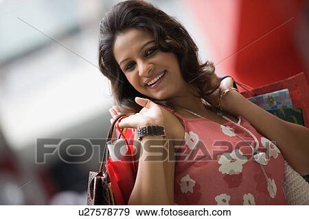 Stock Photo - Woman shopping. Fotosearch