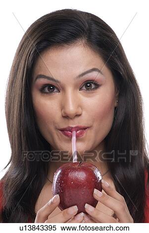 Woman Sipping juice  View Large Photo Image Stock Photography - Woman Sipping juice . Fotosearch