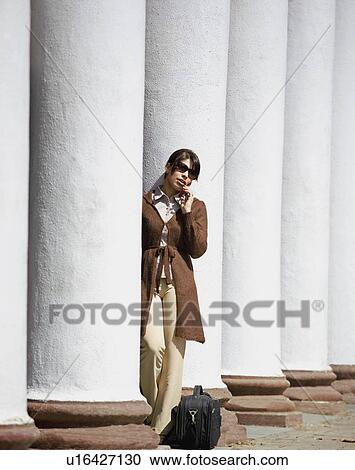 Woman talking on phone View Large Photo Image Stock Image - Woman talking on phone. Fotosearch