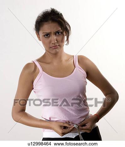 Picture - Woman with a tape measure. Fotosearch