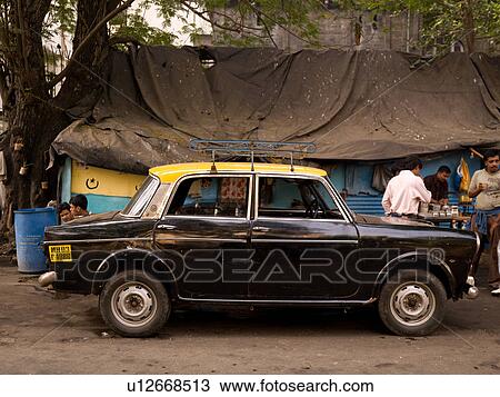 Black car with yellow roof in India View Large Photo Image Stock Image - Black car with yellow roof in India. Fotosearch