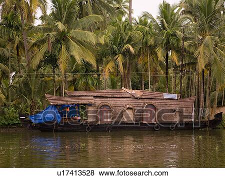 Stock Photo - "Boat on backwater, Kerala, South India". Fotosearch