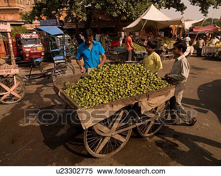 Stock Photography - Cart of food at open market in India. Fotosearch
