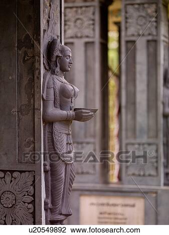 Stock Image - Carved figurine on Hindu Temple in Kerala India. Fotosearch