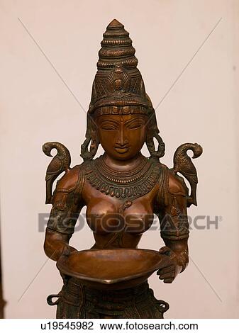 "Carved figurnie holding a dish in Jewtown, Cochin, Kerala, India" View Large Photo Image Stock Image - "Carved figurnie holding a dish in Jewtown, Cochin, Kerala, India". Fotosearch