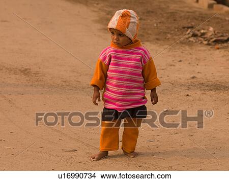 Child standing alone View Large Photo Image Picture - Child standing alone. Fotosearch