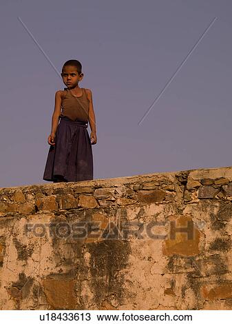 Close up of a child on rooftop in India View Large Photo Image Stock Image - Close up of a child on rooftop in India. Fotosearch