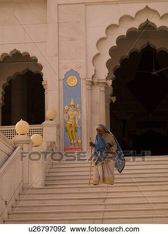 "Elderly woman walking down steps in Agra, India" View Large Photo Image Stock Image - "Elderly woman walking down steps in Agra, India". Fotosearch