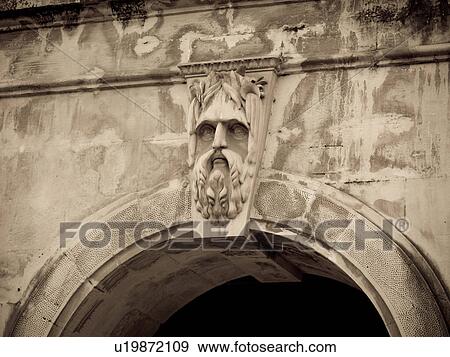 Engraved face on building in Mumbai India View Large Photo Image Stock Photo - Engraved face on building in Mumbai India. Fotosearch