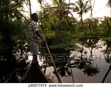Fisherman on his boat in India View Large Photo Image Picture - Fisherman on his boat in India. Fotosearch