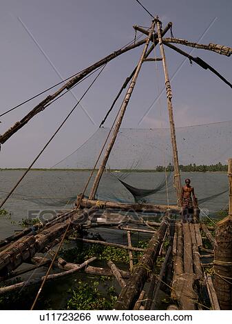 Fisherman with fishing nets View Large Photo Image Stock Photograph - Fisherman with fishing nets. Fotosearch