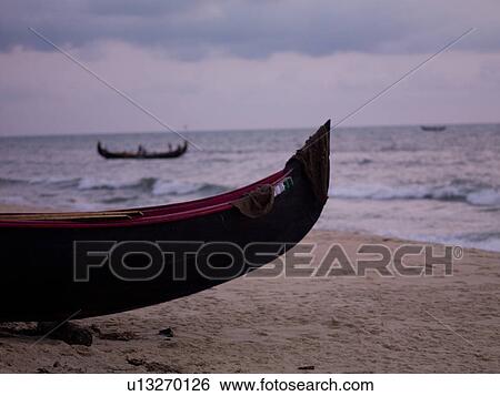 Stock Photograph - "Fishing boat on the Arabian Sea, Kerala, India". Fotosearch