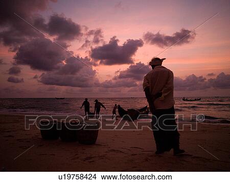 Picture - "Fishing boat on the beach of the Arabian Sea, Kerala, India". Fotosearch