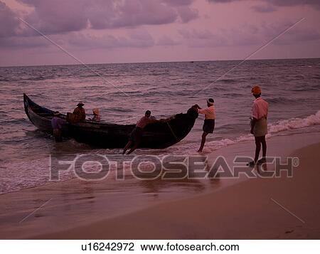 "Fishing boat on the beach of the Arabian Sea, Kerala, India" View Large Photo Image Stock Image - "Fishing boat on the beach of the Arabian Sea, Kerala, India". Fotosearch