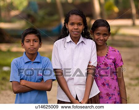 Girls and boy posing for the camera in India View Large Photo Image Stock Photo - Girls and boy posing for the camera in India. Fotosearch