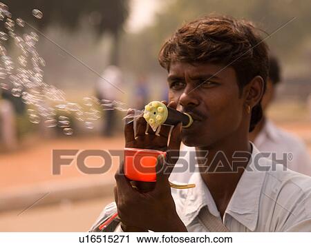 Indian Man blowing bubbles View Large Photo Image Stock Image - Indian Man blowing bubbles. Fotosearch