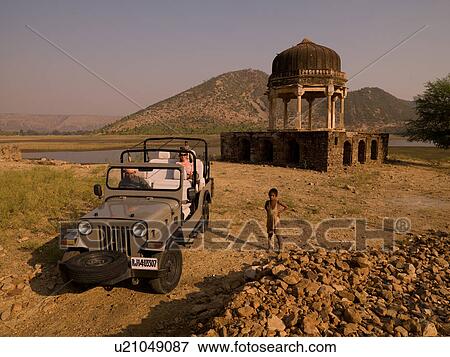 Jeep vehicle in the rural area of India View Large Photo Image Stock Photo - Jeep vehicle in the rural area of India. Fotosearch