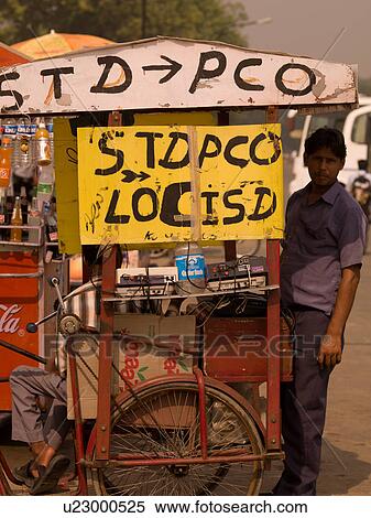 Stock Photography - Man at market stand in India. Fotosearch