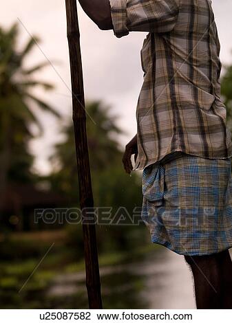 "Man rowing his boat in backwater, Kerala, South India" View Large Photo Image Stock Image - "Man rowing his boat in backwater, Kerala, South India". Fotosearch
