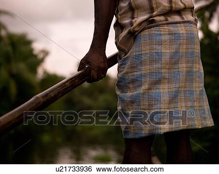 "Man rowing his boat in backwater, Kerala, South India" View Large Photo Image Stock Photograph - "Man rowing his boat in backwater, Kerala, South India". Fotosearch