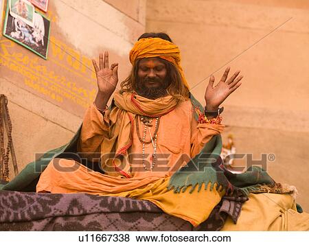 Stock Photo - Man saying prayers in India. Fotosearch