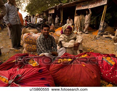 Men beside bags of flowers in India View Large Photo Image Stock Photography - Men beside bags of flowers in India. Fotosearch