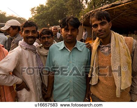 Stock Image - Men on the street in India. Fotosearch