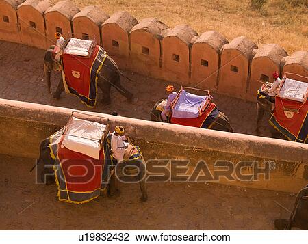 Stock Image - "People riding elephants in Amber Fort, Jaipur, India". Fotosearch