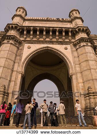 People standing in front of archway View Large Photo Image Stock Photo - People standing in front of archway. Fotosearch