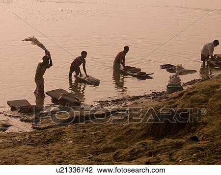 People washing cloths in the Ganges in India View Large Photo Image Stock Image - People washing cloths in the Ganges in India. Fotosearch