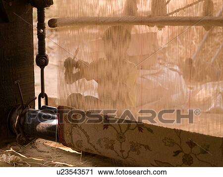 Stock Image - "Rajasthan, India - rug being weaved". Fotosearch