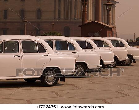 Row of white cars in Delhi India View Large Photo Image Stock Image - Row of white cars in Delhi India. Fotosearch