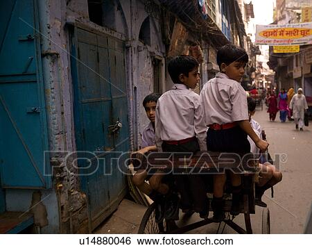 School boys pulled behind a bicycle in India View Large Photo Image Stock Photograph - School boys pulled behind a bicycle in India. Fotosearch